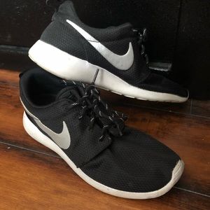 Black Nike Roshe athletic shoes